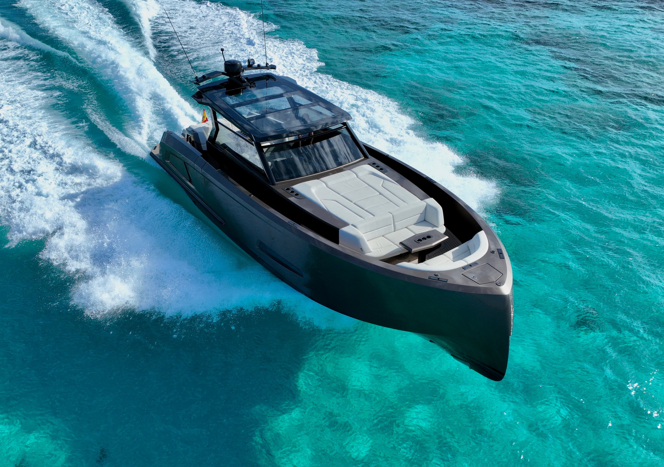 Mar y Luz Charter yacht cutting through turquoise water at speed, Ibiza
